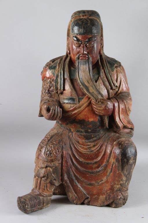 A large Chinese carved wood statue of Guan Yu. An auction of important Oriental works of art