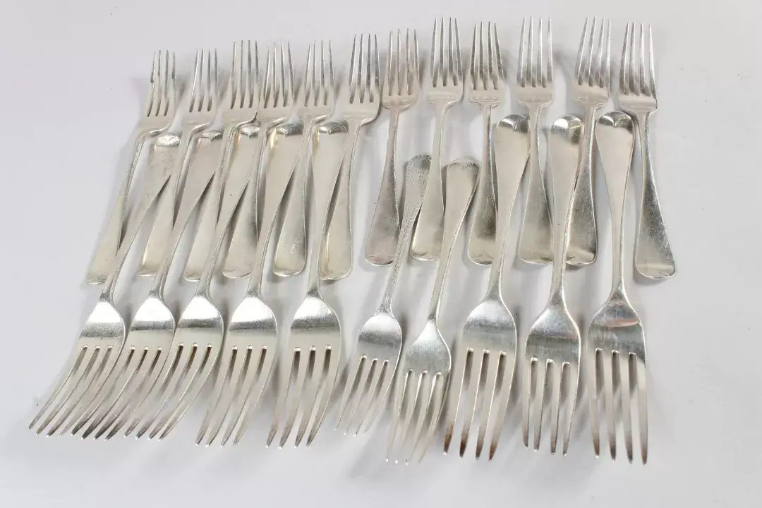 Twenty two various Georgian and Victorian silver table and dessert forks. Weight 42ozs. Oriental and fine antique 26