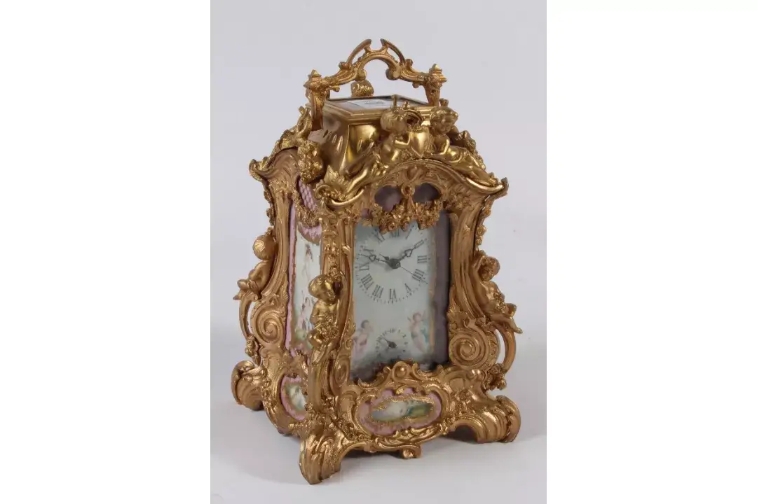A gilt bronze sevres style repeating carriage clock