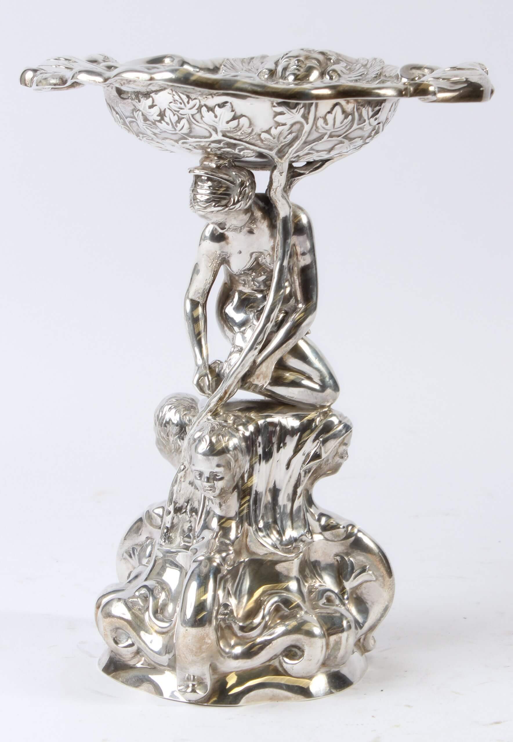 A Victorian cast silver comport, a classical female nude holding a